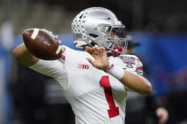 Ohio State quarterback Justin Fields warms up before the Sugar Bowl NCAA college football game against Clemson Friday, Jan. 1, 2021, in New Orleans. (AP Photo/John Bazemore)