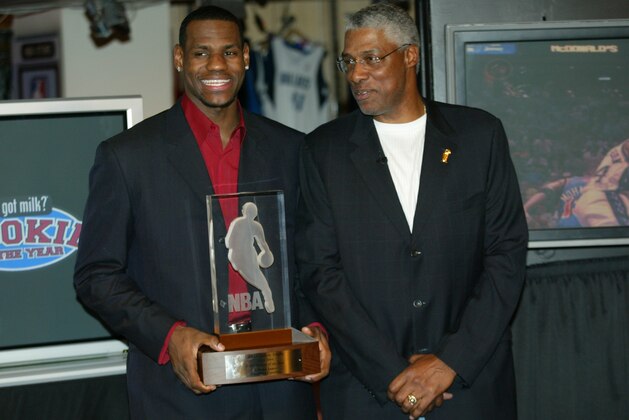 NBA legend Julius 'Dr. J' Erving, right, congratulates Cleveland Cavaliers' LeBron James after James was officially presented the NBA Rookie of the Year award at the NBA Store on New York's 5th Avenue, Tuesday, April 20, 2004. (AP Photo/Stuart Ramson)