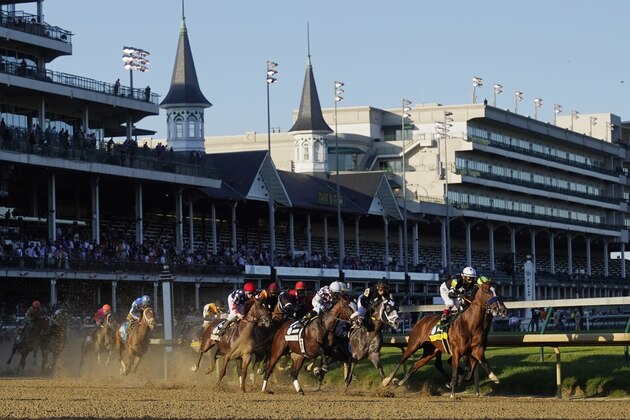 John Velazquez rides Authentic as they lead the pack into turn one in the 146th running of the Kentucky Derby horse race at Churchill Downs, Saturday, Sept. 5, 2020, in Louisville, Ky. (AP Photo/Mark Humphrey)