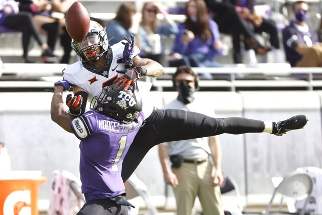 TCU cornerback Tre'vius Hodges-Tomlinson breaks up a pass intended for Oklahoma State wide receiver Tylan Wallace (2) during the first half of an NCAA college football game Saturday, Dec. 5, 2020, in Fort Worth, Texas. (AP Photo/Ron Jenkins)