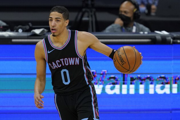 Sacramento Kings guard Tyrese Haliburton (0) against the Cleveland Cavaliers during an NBA basketball game in Sacramento, Calif., Saturday, March 27, 2021. (AP Photo/Jeff Chiu)