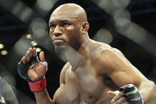 Kamaru Usman during a UFC 261 mixed martial arts fight early Sunday morning, April 25, 2021, in Jacksonville, Fla. This is the first UFC event since the onset of the COVID-19 pandemic to feature a full crowd in attendance. (AP Photo/Gary McCullough)
