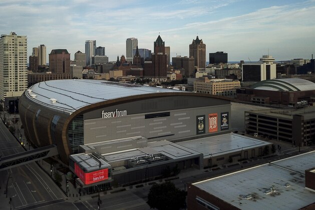 FILE - In this July 29, 2020 file photo, The Fiserv Forum is seen in Milwaukee. Election officials said Tuesday, Oct. 6, 2020, that they scrapped their plans to use the Milwaukee Bucks and Brewers' stadiums as early voting sites in the presidential battleground state of Wisconsin. Milwaukee's election commission had planned to use Fiserv Forum and Miller Park between Oct. 20 and Nov. 1 as sites where people could have voted early in-person or returned absentee ballots they received by mail. The commission developed the plan in an effort to provide safe voting sites during the coronavirus pandemic. (AP Photo/Morry Gash File)
