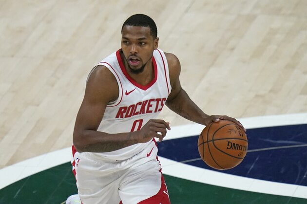 Houston Rockets guard Sterling Brown (0) brings the ball up court in the second half during an NBA basketball game against the Utah Jazz Friday, March 12, 2021, in Salt Lake City. (AP Photo/Rick Bowmer)