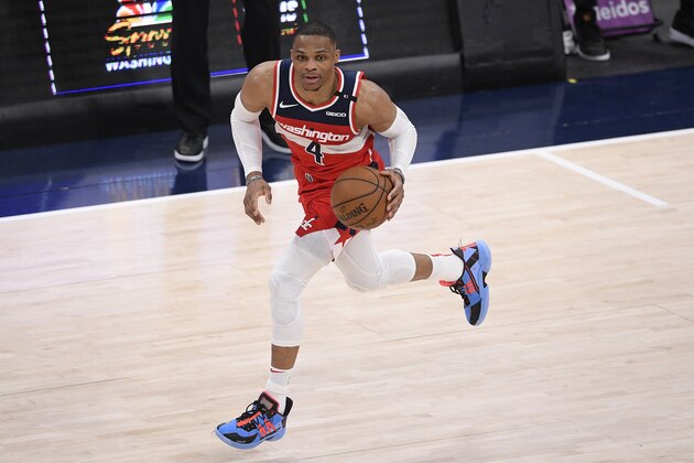 Washington Wizards guard Russell Westbrook (4) dribbles the ball during the second half of an NBA basketball game against the San Antonio Spurs, Monday, April 26, 2021, in Washington. (AP Photo/Nick Wass)