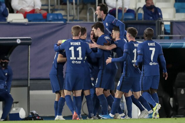 Chelsea players celebrate after Christian Pulisic scored the opening goal during the Champions League semifinal first leg soccer match between Real Madrid and Chelsea at the Alfredo di Stefano stadium in Madrid, Spain, Tuesday, April 27, 2021. (AP Photo/Bernat Armangue)