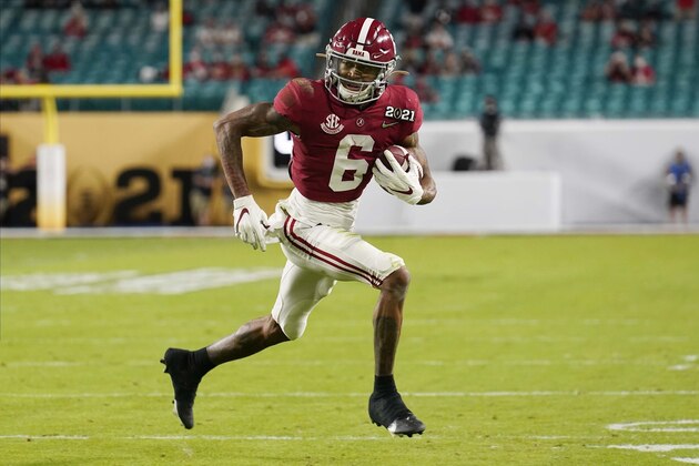 FILE - In this Monday, Jan. 11, 2021 file photo, Alabama wide receiver DeVonta Smith runs for a touchdown against Ohio State during the first half of an NCAA College Football Playoff national championship game in Miami Gardens, Fla.  The New York Giants spent the two months leading up to the draft in a somewhat unexpected dip into the free agency market that filled holes at wide receiver and cornerback, and narrowed their positional needs.(AP Photo/Chris O'Meara, File)