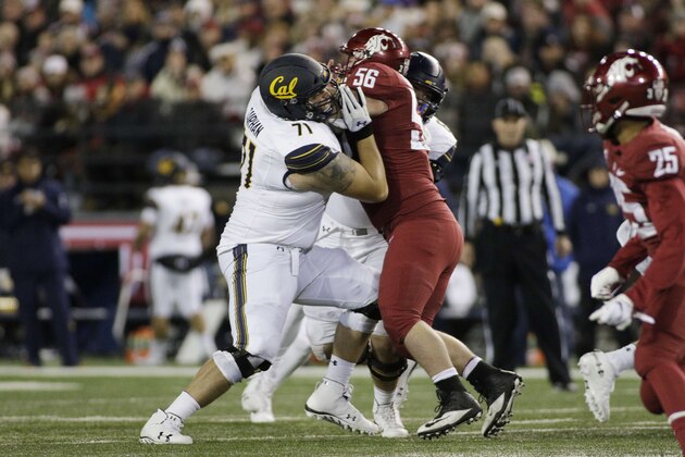 California offensive lineman Jake Curhan (71) blocks Washington State defensive lineman Taylor Comfort (56) during the first half of an NCAA college football game in Pullman, Wash., Saturday, Nov. 3, 2018. (AP Photo/Young Kwak)