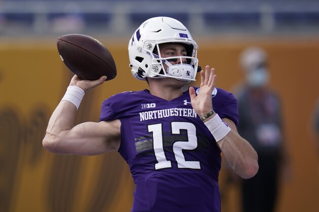 Northwestern quarterback Peyton Ramsey warms up before the Citrus Bowl NCAA college football game against Auburn, Friday, Jan. 1, 2021, in Orlando, Fla. (AP Photo/John Raoux)