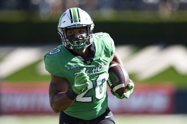 Marshall Thundering Herd running back Brenden Knox (20) runs the ball during an NCAA football game against the Appalachian State Mountaineers on Saturday, Sept. 19, 2020 in Huntington, W.VA. (AP Photo/Emilee Chinn)