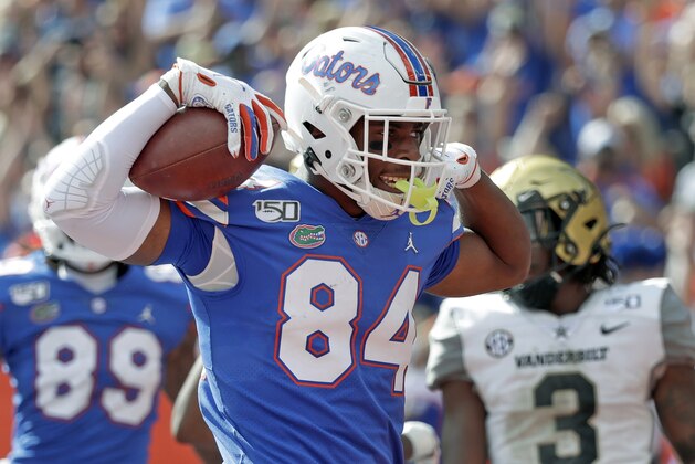 FILE - In this Nov. 9, 2019, file photo, Florida tight end Kyle Pitts (84) celebrates after scoring a touchdown on a 15-yard pass reception during the second half of an NCAA college football game against Vanderbilt, in Gainesville, Fla. Pitts was selected to The Associated Press All-Southeastern Conference football team, Monday, Dec. 9, 2019.(AP Photo/John Raoux, File)