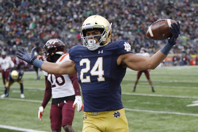 Notre Dame tight end Tommy Tremble (24) runs into the end zone for a after a 4-yard pass reception during the first half of an NCAA college football game against Virginia Tech, Saturday, Nov. 2, 2019, in South Bend, Ind. (AP Photo/Carlos Osorio)