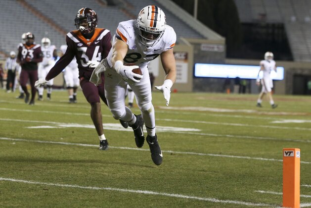 Virginia's Tony Poljan scores a touchdown against Virginia Tech during the second half of an NCAA college football game Saturday, Dec. 12, 2020, in Blacksburg, Va. (Matt Gentry/The Roanoke Times via AP, Pool)