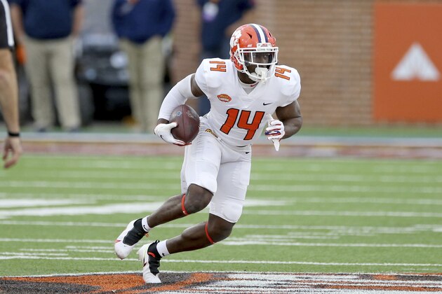 American Team wide receiver Cornell Powell of Clemson (14) runs the ball during the second half of the NCAA college football Senior Bowl in Mobile, Ala, Saturday, Jan. 30, 2021. (AP Photo/Rusty Costanza)