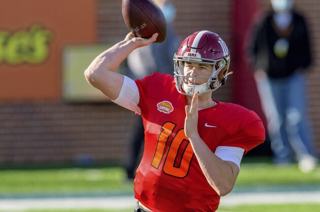 American Team quarterback Mac Jones of Alabama (10) throws during the American Team practice for the NCAA Senior Bowl college football game in Mobile, Ala., Thursday, Jan. 28, 2021. (AP Photo/Matthew Hinton)