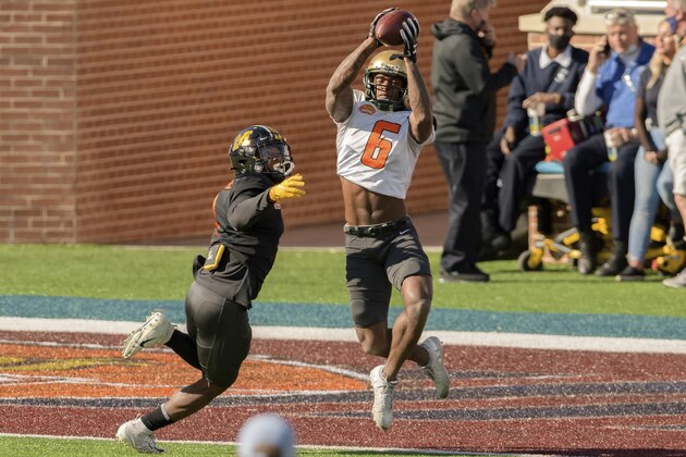 American Team wide receiver Austin Watkins Jr. (6), of UAB, grabs a touchdown against American Team defensive back Joshuah Bledsoe (10, of Missouri, during the American Team practice for the NCAA Senior Bowl college football game in Mobile, Ala., Thursday, Jan. 28, 2021. (AP Photo/Matthew Hinton)