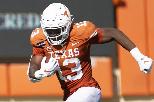 Texas' Brennan Eagles (13) runs after a catch against West Virginia during the second half of an NCAA college football game in Austin, Texas, Saturday, Nov. 7, 2020. (AP Photo/Chuck Burton)