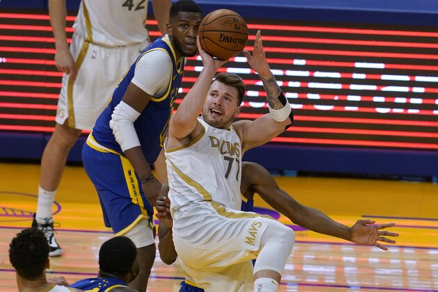 Dallas Mavericks guard Luka Doncic shoots against the Golden State Warriors during the second half of an NBA basketball game in San Francisco, Tuesday, April 27, 2021. (AP Photo/Jeff Chiu)