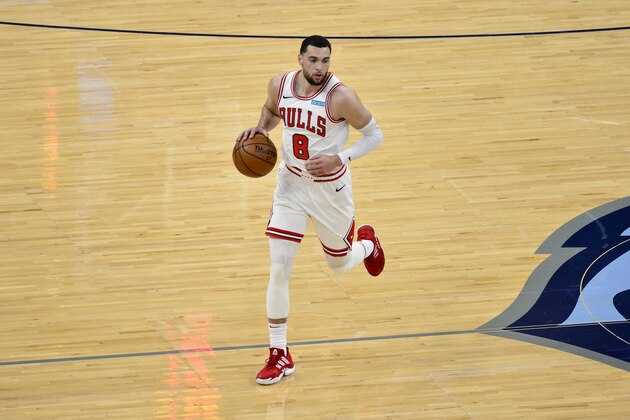 Chicago Bulls guard Zach LaVine (8) handles the ball in the first half of an NBA basketball game against the Memphis Grizzlies Monday, April 12, 2021, in Memphis, Tenn. (AP Photo/Brandon Dill)