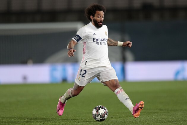 Real Madrid's Marcelo runs with the ball during the Champions League semifinal first leg soccer match between Real Madrid and Chelsea at the Alfredo di Stefano stadium in Madrid, Spain, Tuesday, April 27, 2021. (AP Photo/Bernat Armangue)