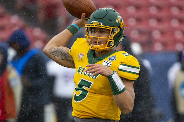 North Dakota State quarterback Trey Lance (5) warms up before the FCS championship NCAA college football game against James Madison, Saturday, Jan. 11, 2020, in Frisco, Texas. (AP Photo/Sam Hodde)