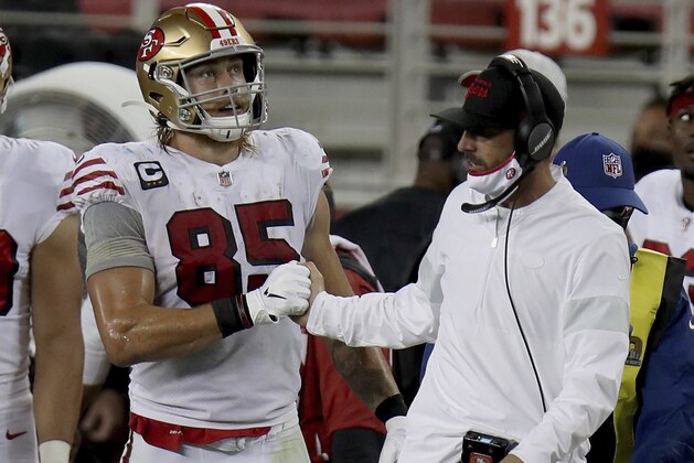 San Francisco 49ers tight end George Kittle (85) congratulates San Francisco 49ers head coach Kyle Shanahan after a victory over the Los Angeles Rams during an NFL football game, Sunday, Oct. 18, 2020, in Santa Clara, Calif. (AP Photo/Scot Tucker)