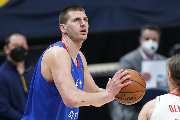 Denver Nuggets center Nikola Jokic (15) looks to shoot against the Houston Rockets during the first half of an NBA basketball game Saturday, April 24, 2021, in Denver. (AP Photo/Jack Dempsey)