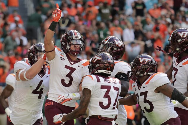 Virginia defensive back Caleb Farley (3) celebrates after intercepting a pass during the first half of an NCAA college football game against Miami, Saturday, Oct. 5, 2019, in Miami Gardens, Fla. (AP Photo/Lynne Sladky)