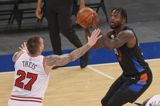 New York Knicks forward Julius Randle (30) shoots as Chicago Bulls center Daniel Theis (27) defends during the first quarter of an NBA basketball game Wednesday, April 28, 2021, in New York. (Vincent Carchietta/Pool Photo via AP)