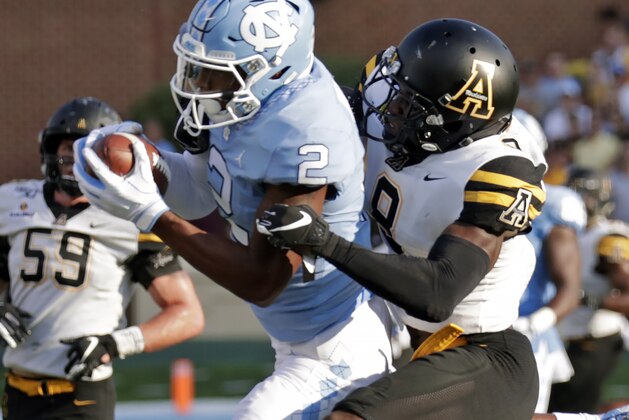 North Carolina's Dyami Brown (2) hauls in a pass against Appalachian State's Shemar Jean-Charles (8) during the third quarter of an NCAA college football game in Chapel Hill, N.C., Saturday, Sept. 21, 2019. (AP Photo/Chris Seward)