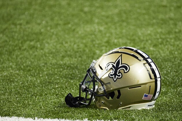 New Orleans Saints helmets on the field against the Detroit Lions during an NFL football game in Detroit, Sunday, Oct. 4, 2020. (AP Images/Rick Osentoski)
