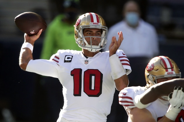 FILE - In this Sunday, Nov. 1, 2020, file photo, San Francisco 49ers quarterback Jimmy Garoppolo passes against the Seattle Seahawks during the first half of an NFL football game in Seattle. The San Francisco 49ers have made a big move to grab their quarterback of the future by trading up with Miami for the No. 3 pick in next month's draft. Drafting a quarterback would likely lead to the end of Jimmy Garoppolo's tenure in San Francisco either in a trade this season or after a year if the Niners opt to keep a veteran to help ease the transition for a rookie QB. (AP Photo/Scott Eklund, File)