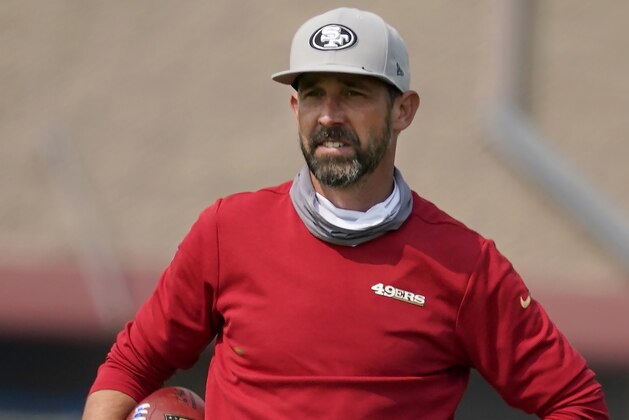 San Francisco 49ers head coach Kyle Shanahan watches a drill during football practice at the 49ers training facility in Santa Clara, Calif., Sunday, Aug. 23, 2020. (Tony Avelar/San Francisco Chronicle via AP, Pool)