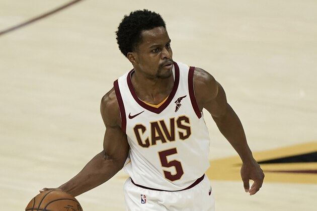 Cleveland Cavaliers' Yogi Ferrell drives against the Utah Jazz in the second half of an NBA basketball game, Tuesday, Jan. 12, 2021, in Cleveland. (AP Photo/Tony Dejak)