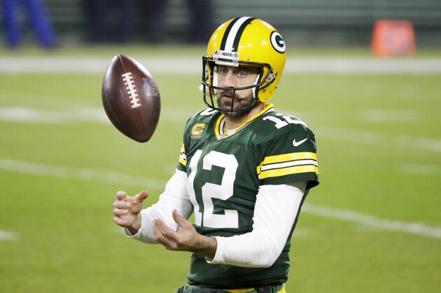 Green Bay Packers' Aaron Rodgers warms up before an NFL football game against the Carolina Panthers Saturday, Dec. 19, 2020, in Green Bay, Wis. (AP Photo/Mike Roemer)