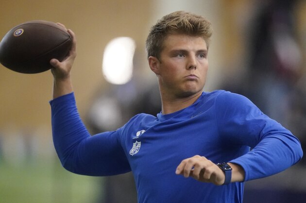BYU quarterback Zach Wilson warms up before participating in the school's pro day  football workout for NFL scouts Friday, March 26, 2021, in Provo, Utah. (AP Photo/Rick Bowmer)