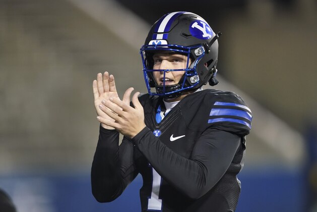 BYU quarterback Zach Wilson encourages his teammates during warmups before an NCAA college football game against San Diego State Saturday, Dec. 12, 2020, in Provo, Utah. (AP Photo/George Frey, Pool)