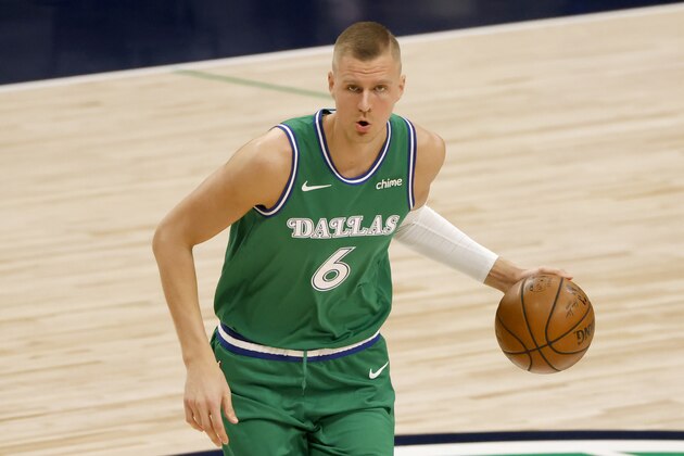 Dallas Mavericks center Kristaps Porzingis (6) handles the ball against the New York Knicks during the first half of an NBA basketball game, Friday, April 16, 2021, in Dallas. (AP Photo/Ron Jenkins)