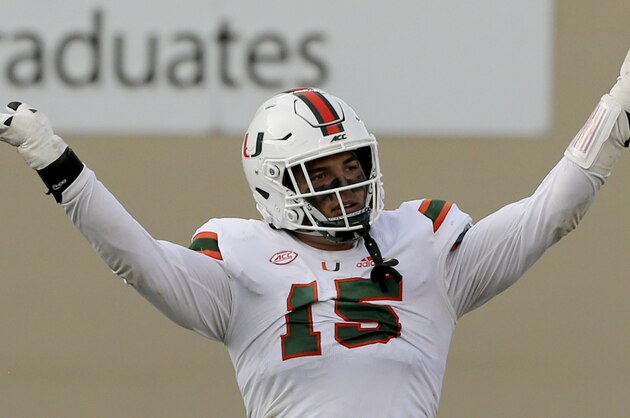 Jaelan Phillips of Miami celebrates a defensive stop during the second half of an NCAA college football game against Virginia Tech Saturday, Nov. 14, 2020, in Blacksburg, Va. (Matt Gentry/The Roanoke Times via AP, Pool)