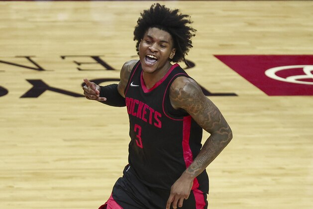Houston Rockets guard Kevin Porter Jr. (3) reacts after making a basket during the fourth quarter of an NBA basketball game against the Milwaukee Bucks Thursday, April 29, 2021, in Houston. (Troy Taormina/Pool Photo via AP)