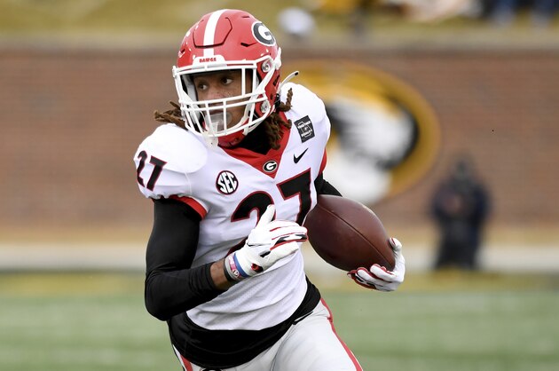 Georgia defensive back Eric Stokes runs with the ball after intercepting a pass during the first half of an NCAA college football game against Missouri Saturday, Dec. 12, 2020, in Columbia, Mo. (AP Photo/L.G. Patterson)