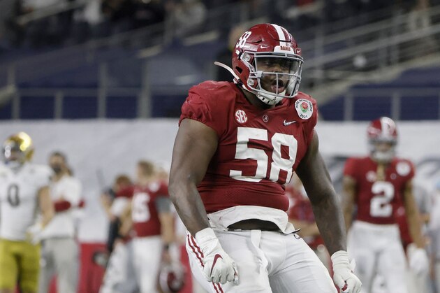 Alabama defensive lineman Christian Barmore (58) celebrates a sack against Notre Dame during the Rose Bowl NCAA college football game in Arlington, Texas, Friday, Jan. 1, 2021. (AP Photo/Michael Ainsworth)