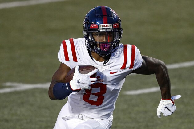 Mississippi wide receiver Elijah Moore (8) runs for yardage during an NCAA college football game against Vanderbilt, Saturday, Oct. 31, 2020, in Nashville, Tenn. Moore was selected to The Associated Press All-America first-team offense, Monday, Dec. 28, 2020. (AP Photo/Wade Payne)