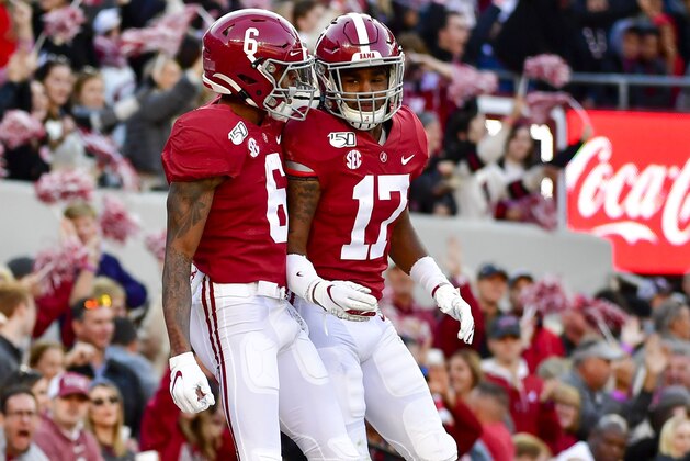 Alabama wide receiver DeVonta Smith (6) and Alabama wide receiver Jaylen Waddle (17) celebrate Smith's touchdown against LSU in the first half of an NCAA football game Saturday, Nov. 9, 2019, in Tuscaloosa, Ala. (AP Photo/Vasha Hunt)