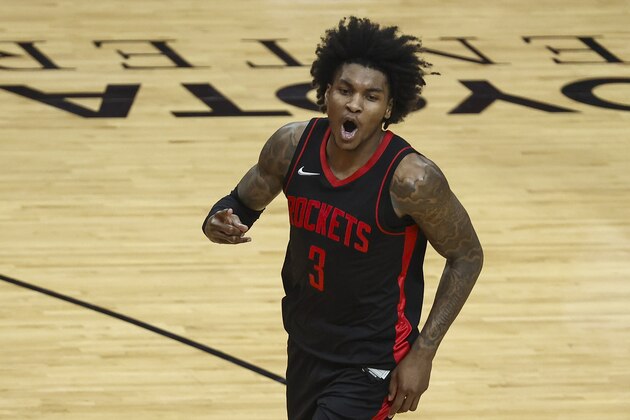 Houston Rockets guard Kevin Porter Jr. (3) reacts after making a basket during the fourth quarter of an NBA basketball game against the Milwaukee Bucks Thursday, April 29, 2021, in Houston. (Troy Taormina/Pool Photo via AP)