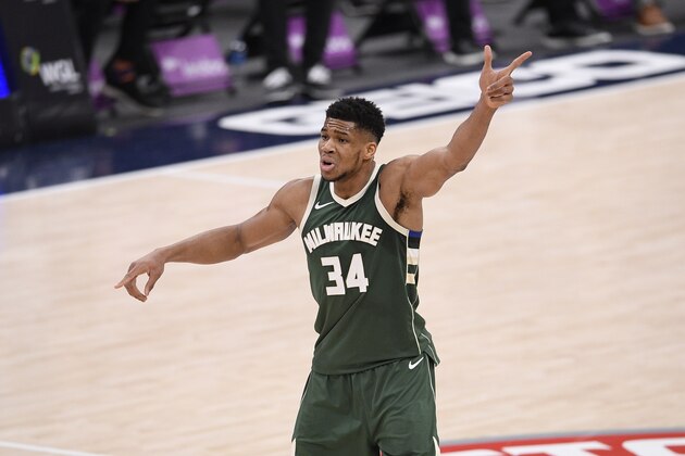 Milwaukee Bucks forward Giannis Antetokounmpo (34) gestures during the first half of an NBA basketball game against the Washington Wizards, Monday, March 15, 2021, in Washington. (AP Photo/Nick Wass)
