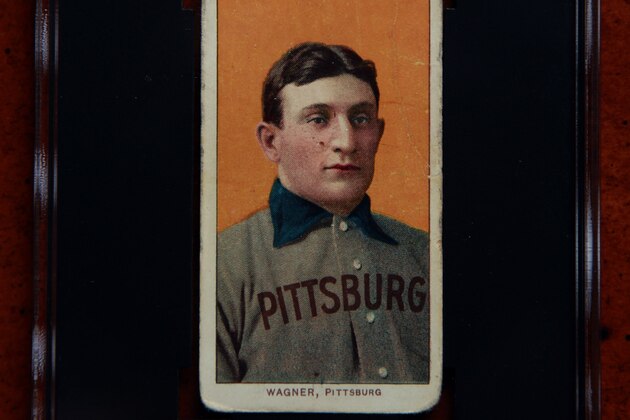 A 1909 Honus Wagner baseball card, one of the most sought-after sports collectibles in the world, is seen in a protective case Monday, March 26, 2012, in Sunset Hills, Mo. Bill Goodwin, who will facilitate an online auction starting on Tuesday for the card, expects it to fetch at least $1 million and perhaps as much as $1.5 million. (AP Photo/Jeff Roberson)