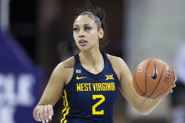 West Virginia guard Kysre Gondrezick (2) looks for room against the TCU defense during an NCAA basketball game on Saturday, Jan. 30, 2020, in Fort Worth, Texas. West Virgina won 79-70. (AP Photo/Brandon Wade)