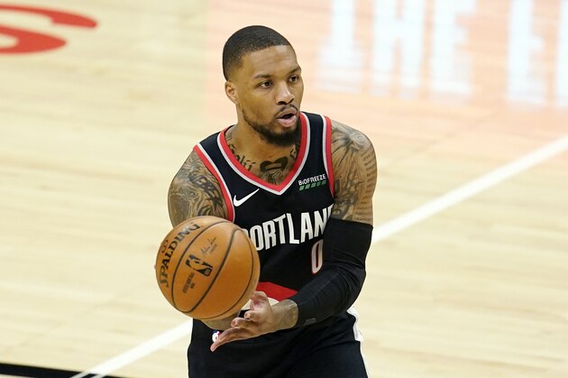 Portland Trail Blazers guard Damian Lillard passes during an NBA basketball game against the Los Angeles Clippers Tuesday, April 6, 2021, in Los Angeles. (AP Photo/Marcio Jose Sanchez)