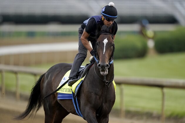 Kentucky Derby entrant Midnight Bourbon works out Churchill Downs Wednesday, April 28, 2021, in Louisville, Ky. The 147th running of the Kentucky Derby is scheduled for Saturday, May 1. (AP Photo/Charlie Riedel)